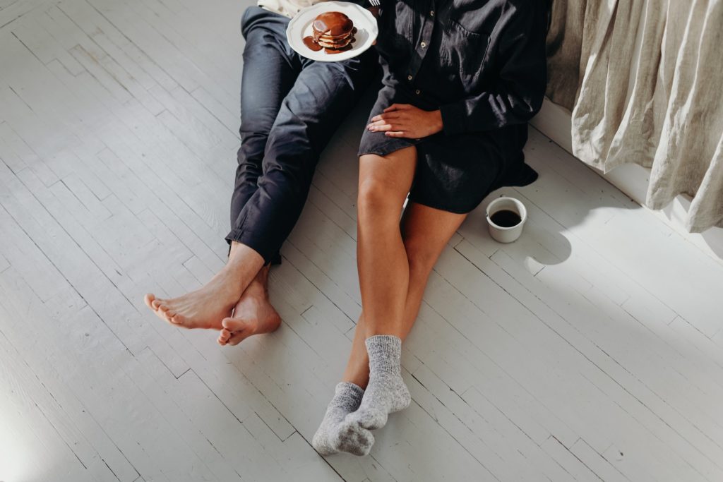 couple having breakfast on the floor